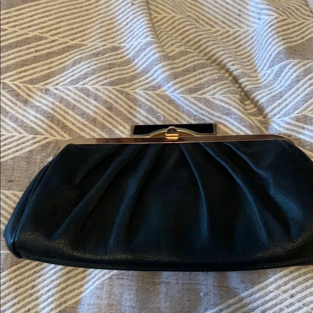 Black leather and gold clutch